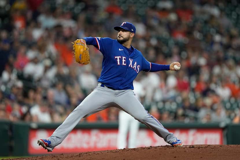 Texas Rangers starting pitcher Martin Perez throws against the Texas Rangers during the...