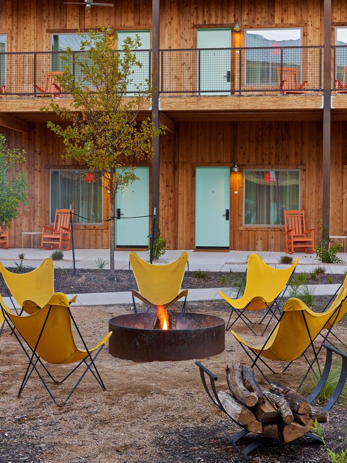 Outdoor fire pits and rocking chairs give Lone Star Court a laid-back vibe.