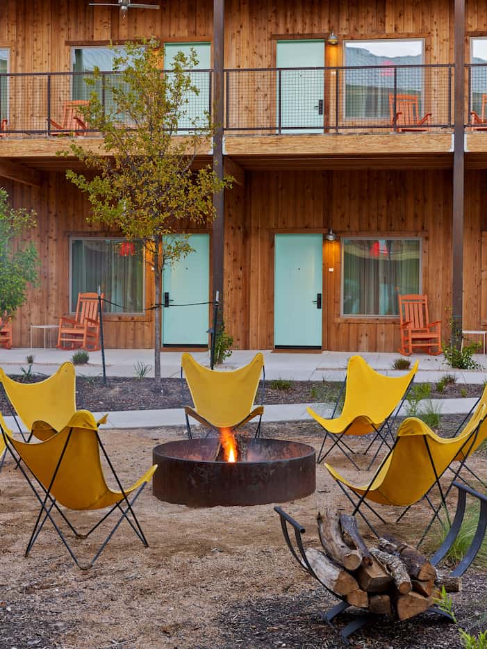 Outdoor fire pits and rocking chairs give Lone Star Court a laid-back vibe.