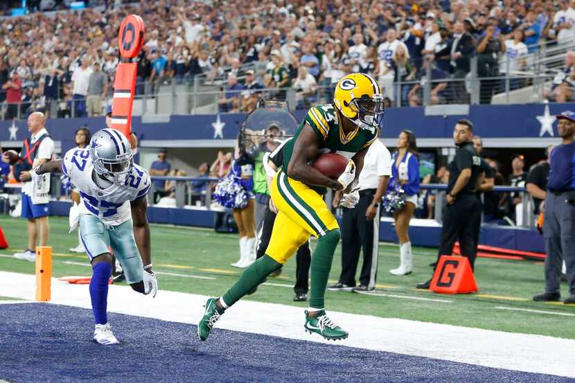 Green Bay Packers wide receiver Davante Adams (17) scores the game winning touchdown over...