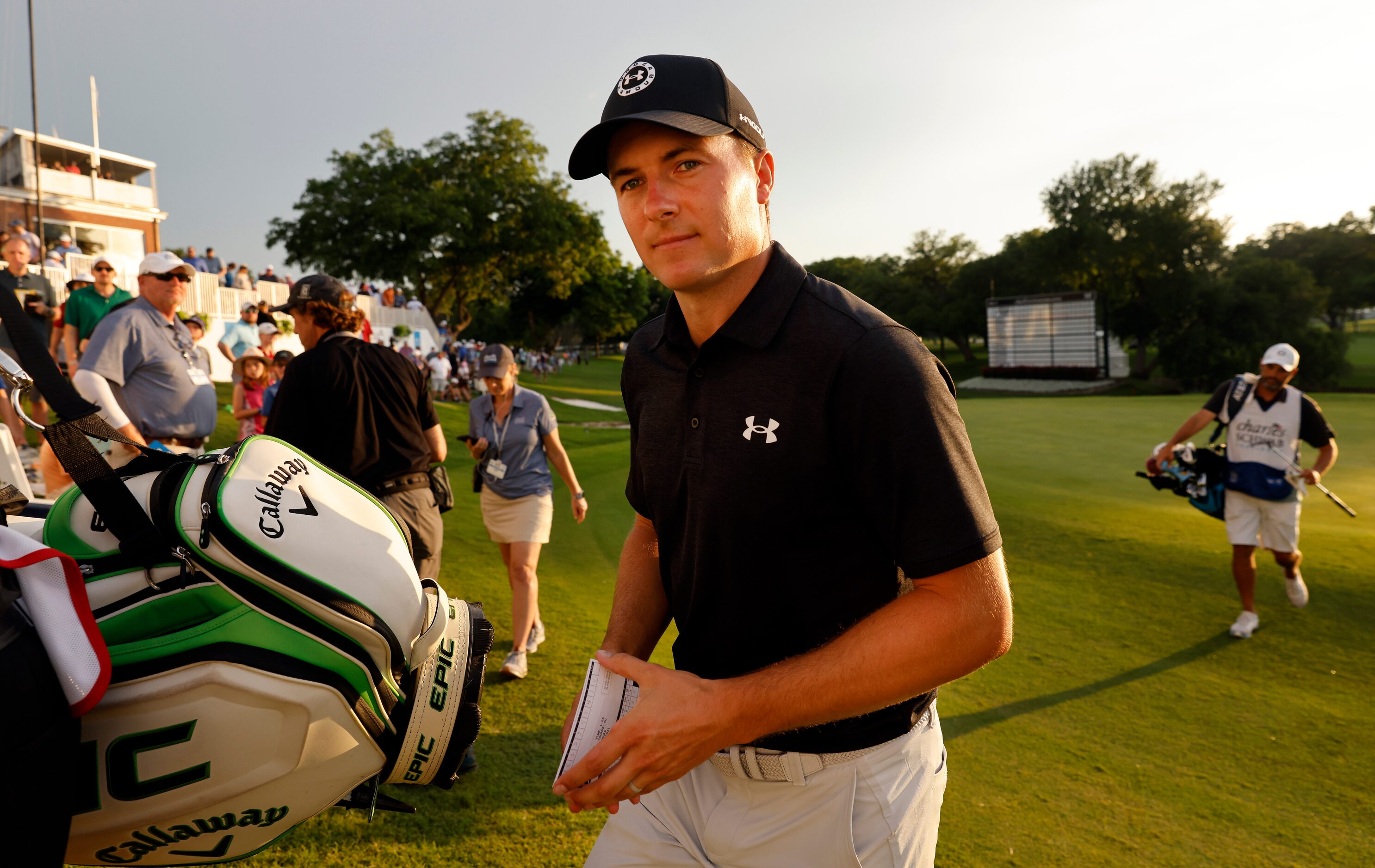 Professional golfer Jordan Spieth walks off the 18th green with an 11-under lead after round...