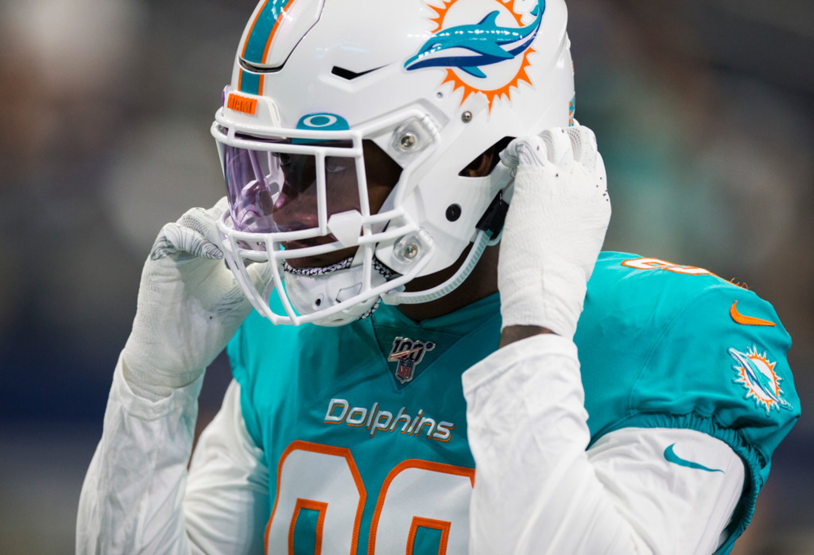 Miami Dolphins defensive end Taco Charlton (96) warms up before an NFL game between the...