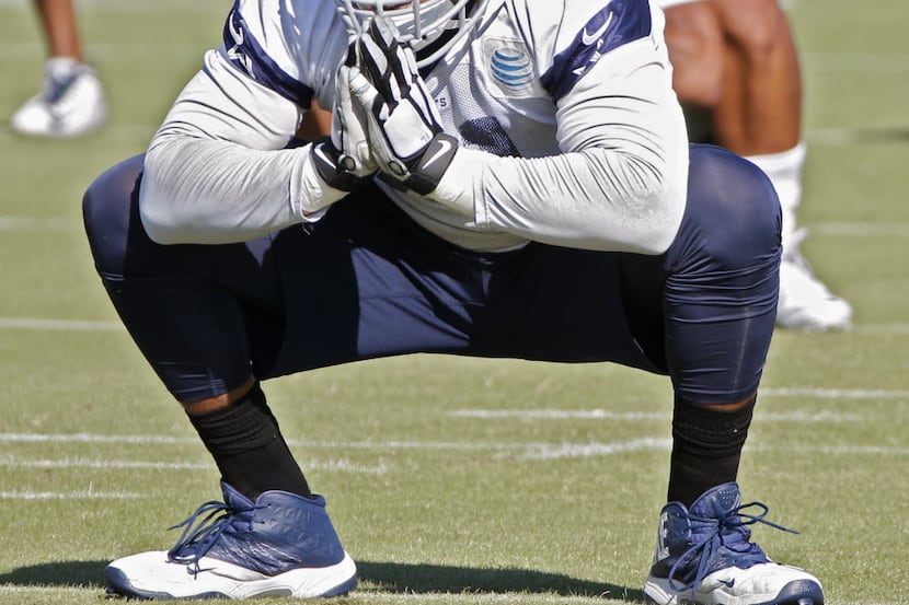 La'el Collins stretches out during Dallas Cowboys practice at Valley Ranch in Irving October...