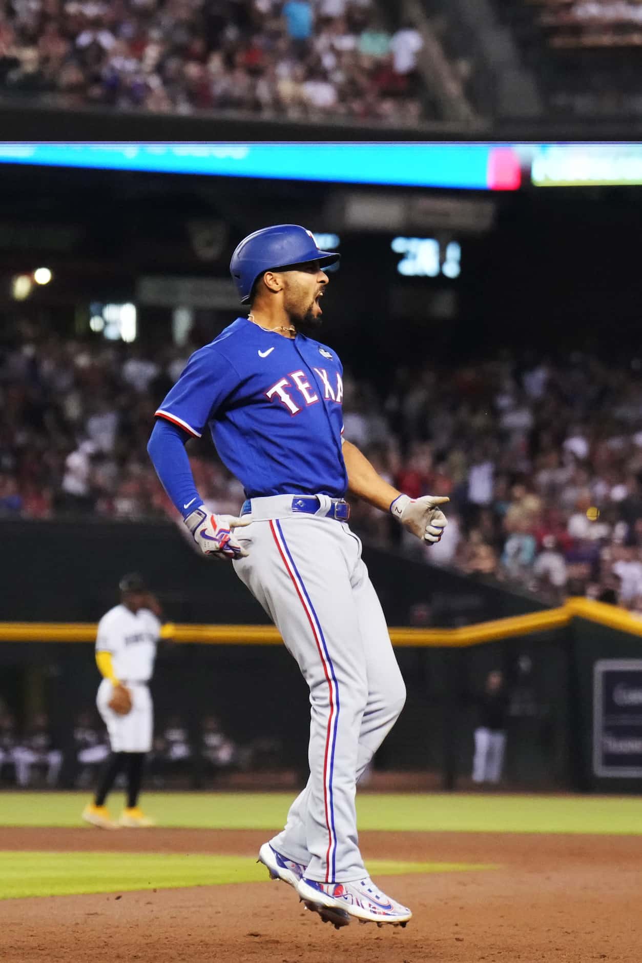 Texas Rangers’ Marcus Semien celebrates hitting a two-run home run during the ninth inning...