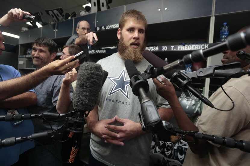 Center Travis Frederick (70) talks to the media during Dallas Cowboys rookie minicamp at...