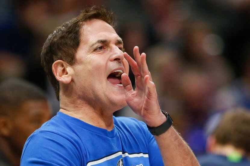Mark Cuban disputes an official's call during the second half of a NBA matchup between the...