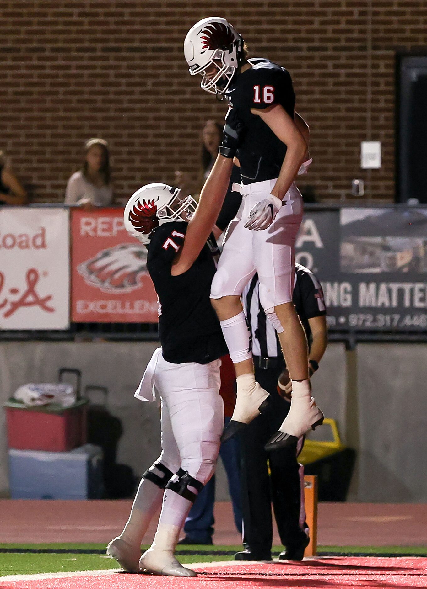 Argyle wide receiver Wayne Pritts (16) celebrates with offensive lineman Austin Criswell...