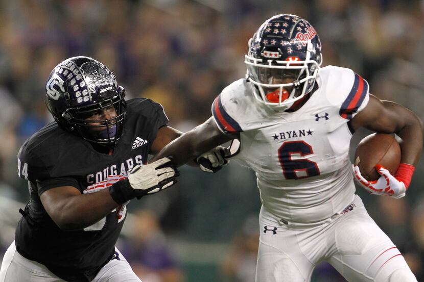 Denton Ryan running back Anthony Hill Jr. (6), right, tries to elude College Station...