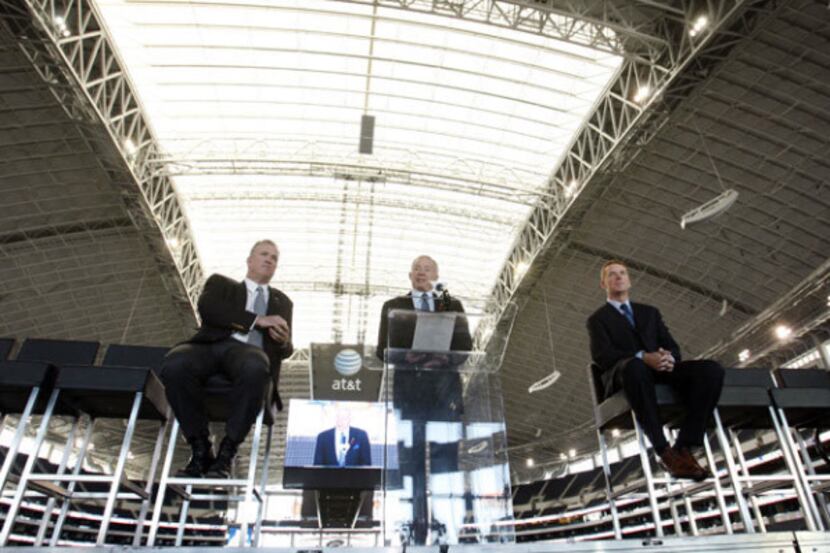 Dallas Cowboys owner Jerry Jones (center) talks about new Dallas Cowboys head coach Jason...