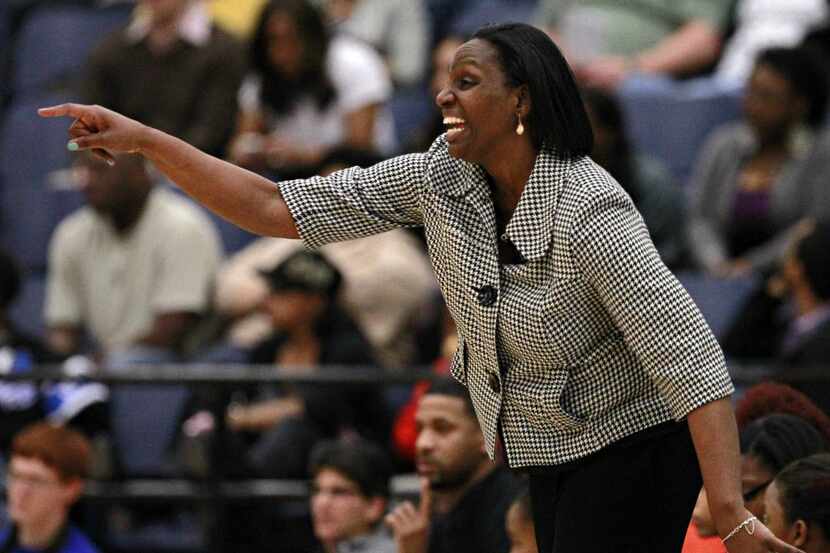 Cedar Hill head coach Andrea Robinson yells at players during the second half of a 65-29...