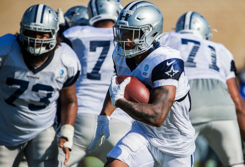 Cowboys running back Tony Pollard (36) runs the ball during an afternoon practice at...