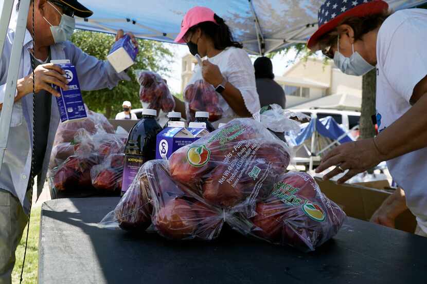Bags By Bedi fed over 100 families during a food drive at St. Cecilia's Catholic Church in...
