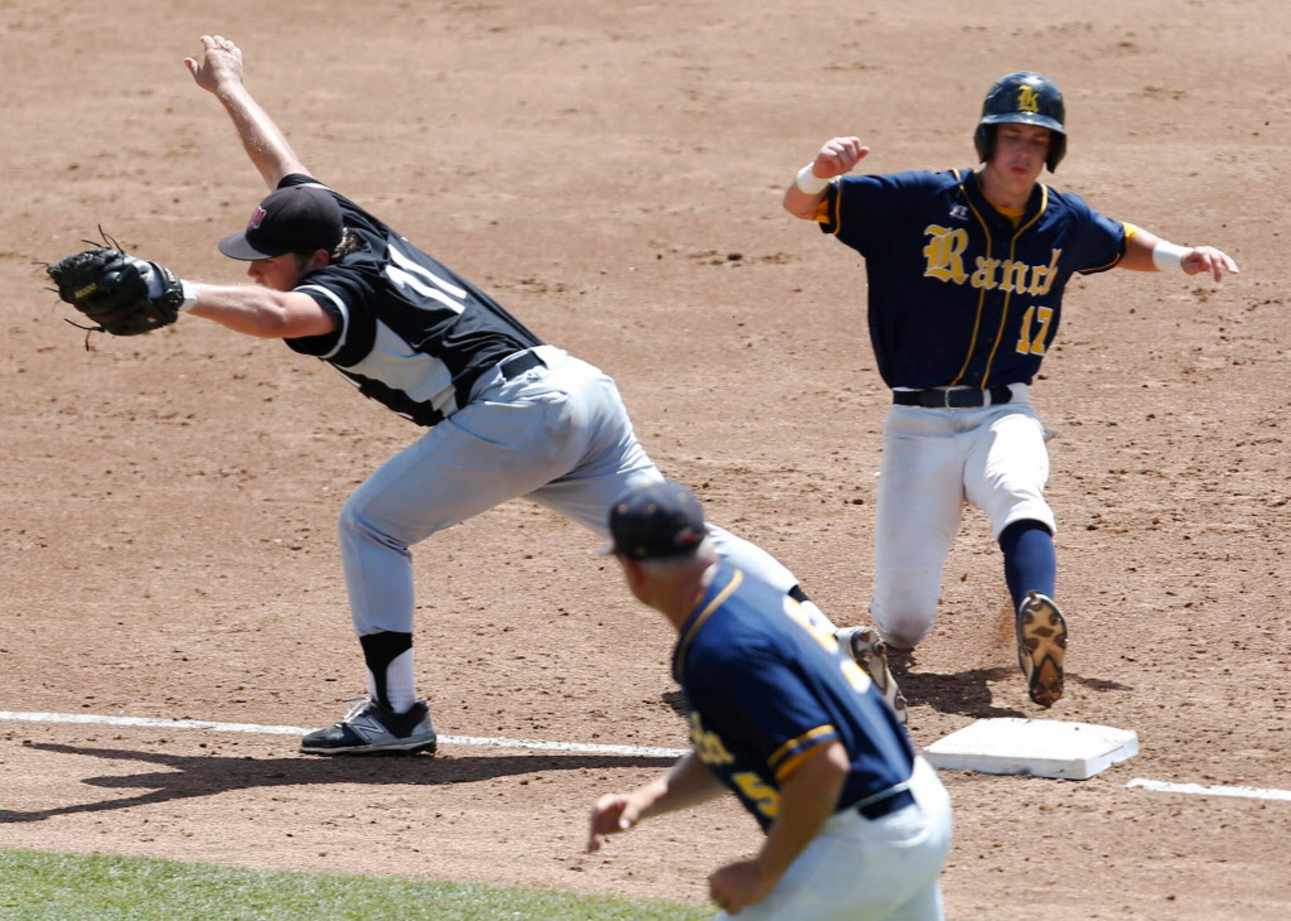 Martin's Josh Avery (11) lifts his foot off the bag as Cypress Ranch's Tyler Bielamowicz...