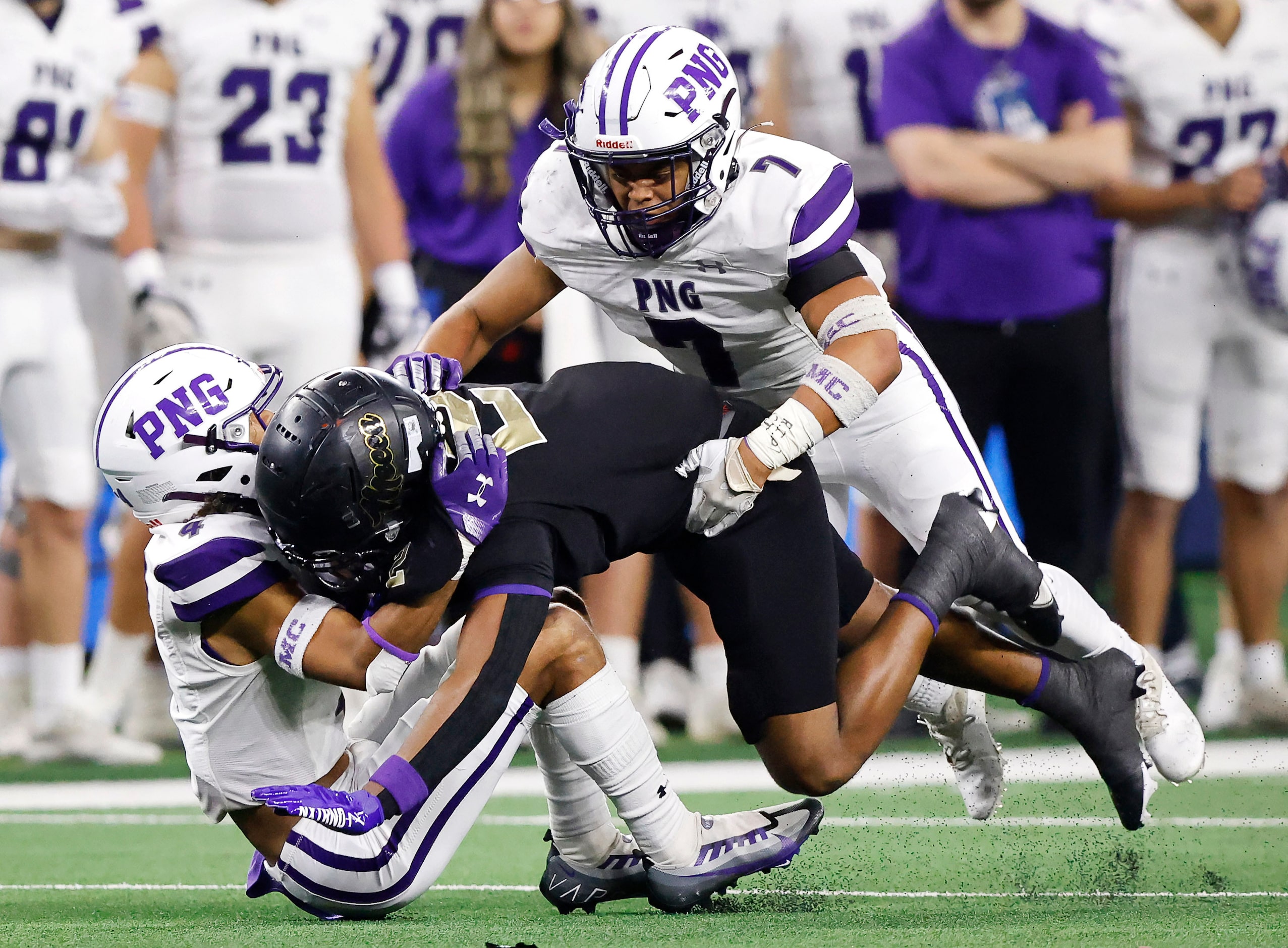 Port Neches-Grove defensive back Torryan Hinton (2) and linebacker Sean Gardiner (7) tackle...