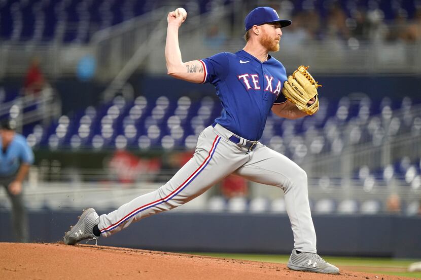 Texas Rangers starting pitcher Jon Grey throws in the second inning during Game 2 of a...