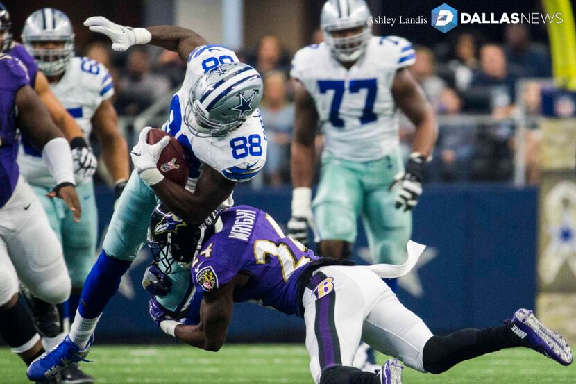 Dallas Cowboys wide receiver Dez Bryant (88) is tackled by Baltimore Ravens cornerback Kyle...