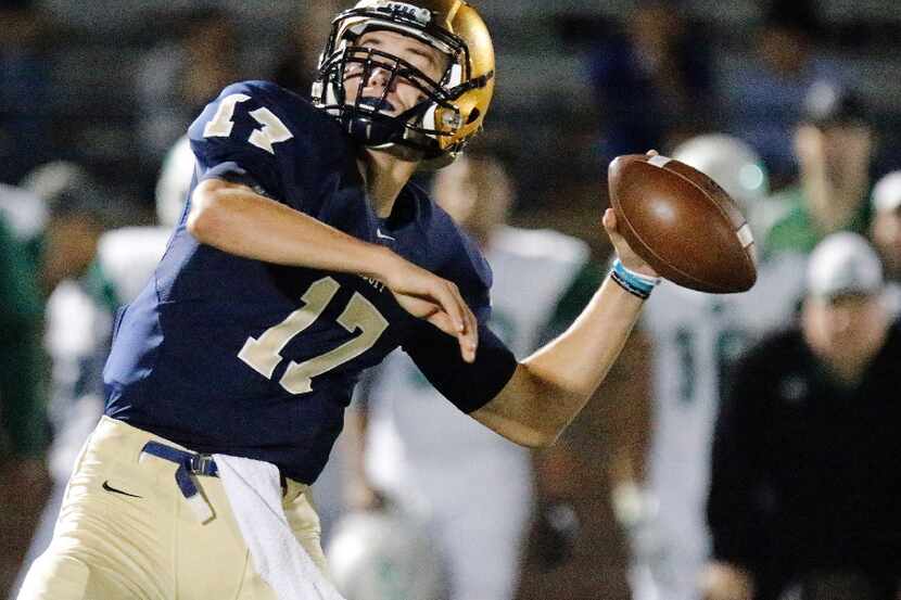 Jesuit quarterback Jacob Palisch (17) tosses the football during the first half as Dallas...