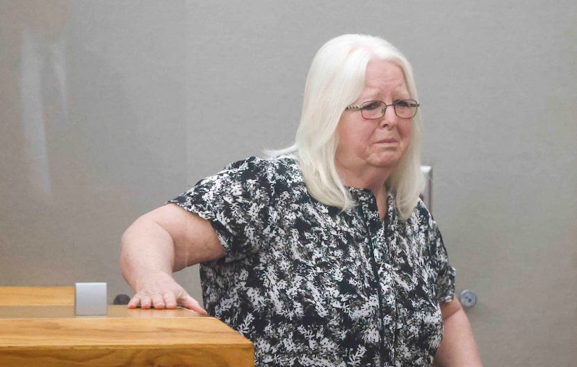 Debbie Young, the mother of murder victim David Young, becomes emotional as she leaves the...