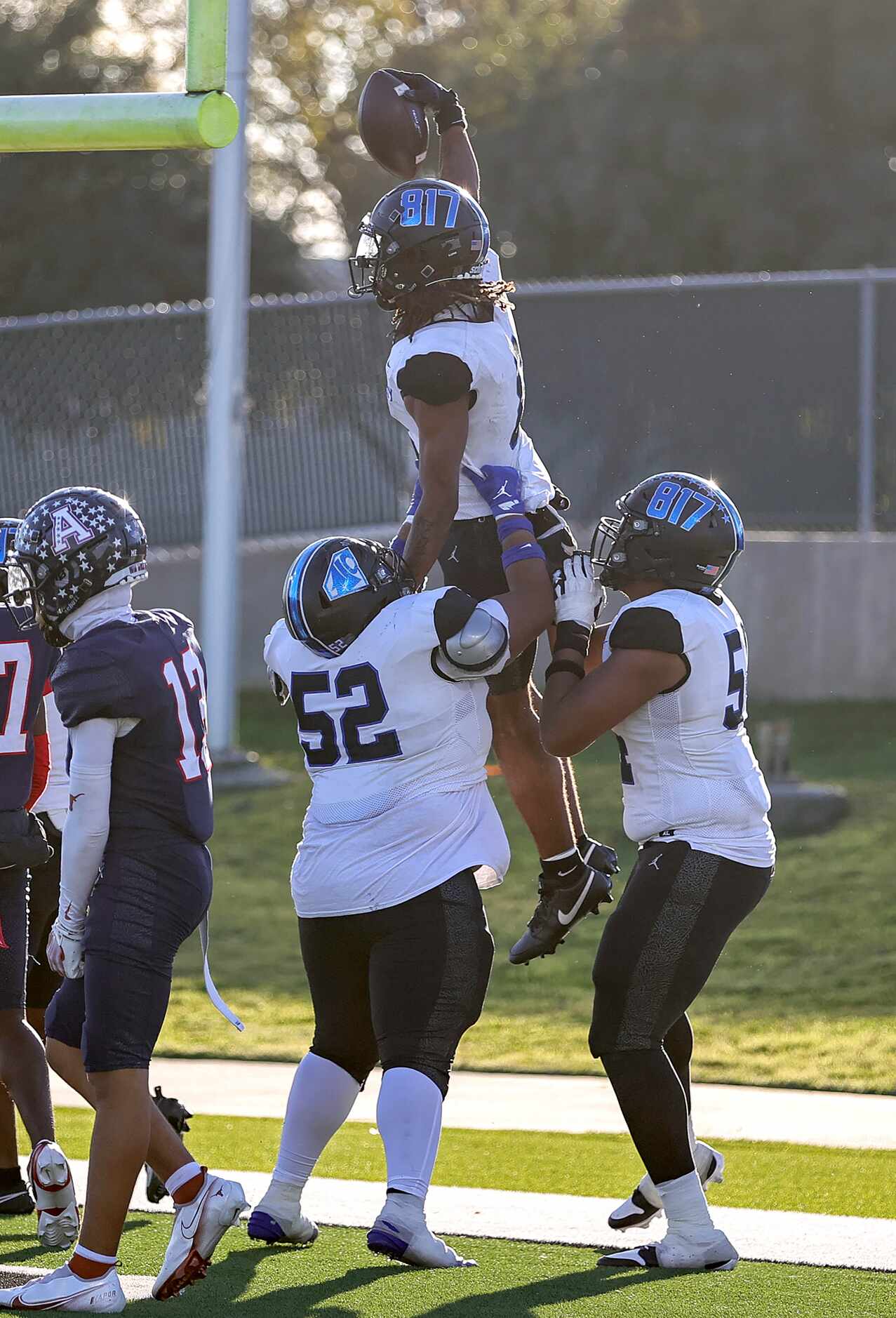 North Crowley running back Ashton Searl (8) celebrates with offensive lineman Ronnie...