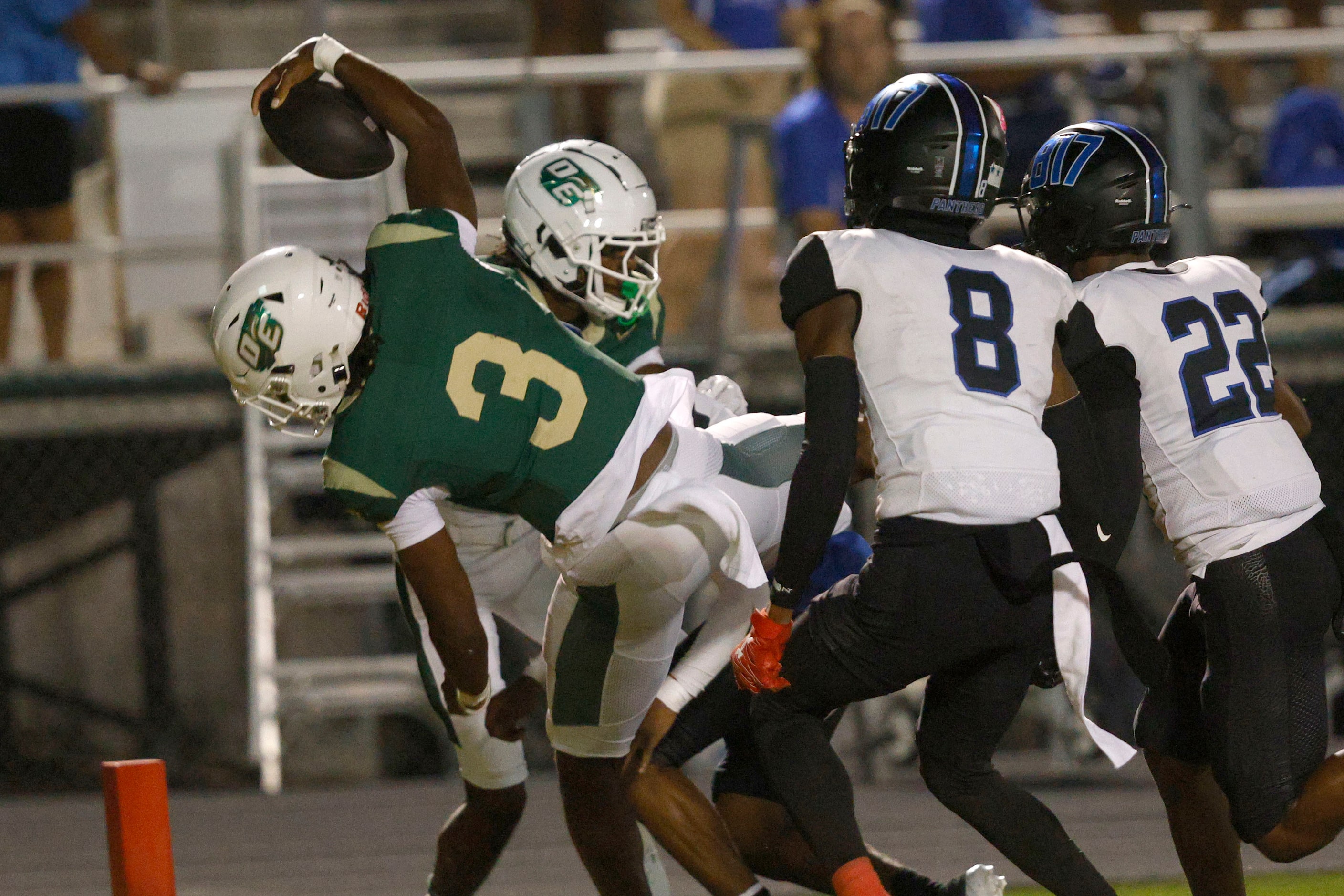 DeSoto's Kelden Ryan (3) scores a touchdown over North Crowley players during the first half...