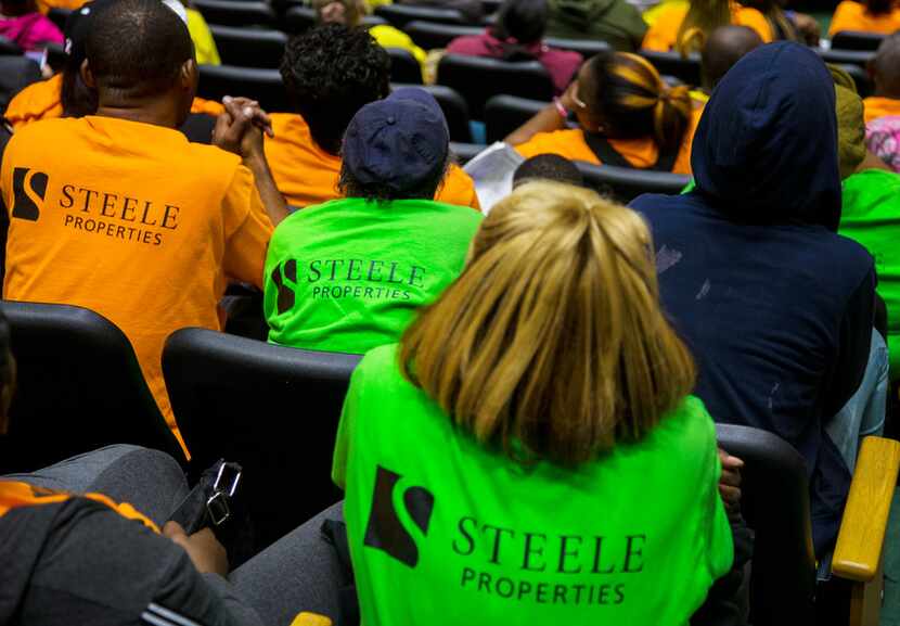 Two buses full of people wearing Steele Properties shirts went to Dallas City Hall on Monday.