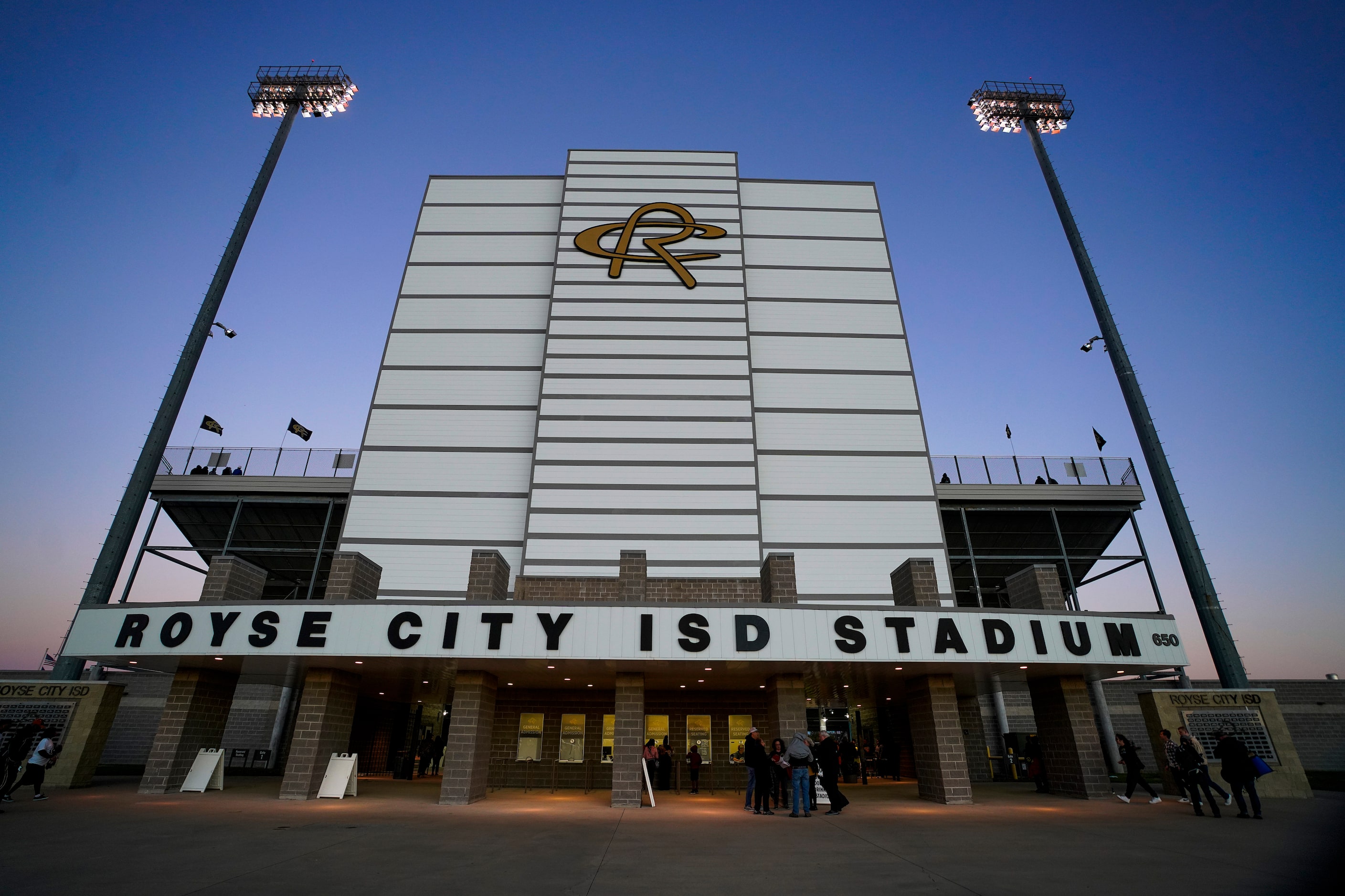 Fans arrives fora District 8-5A Division II high school football game between Royse City and...