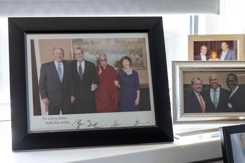 Among dozens of framed photographs in Larry James' CitySquare office is this one with former...