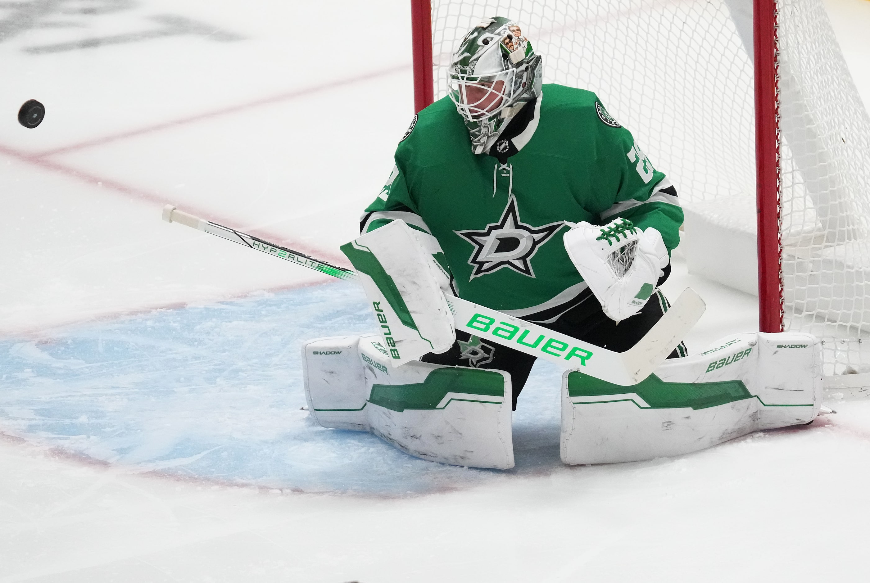 Dallas Stars goaltender Jake Oettinger makes a save during the third period of an NHL hockey...