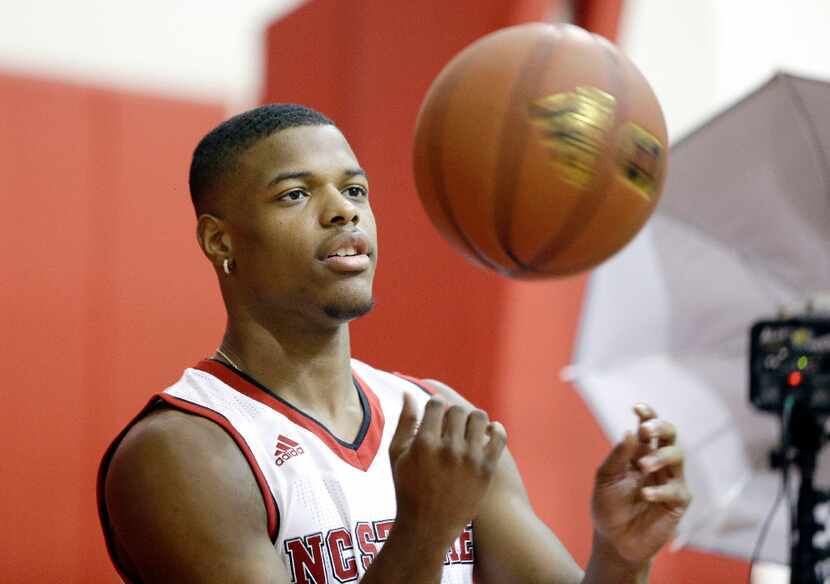 FILE - In this Sept. 29, 2016, file photo, North Carolina State's Dennis Smith Jr. tosses a...