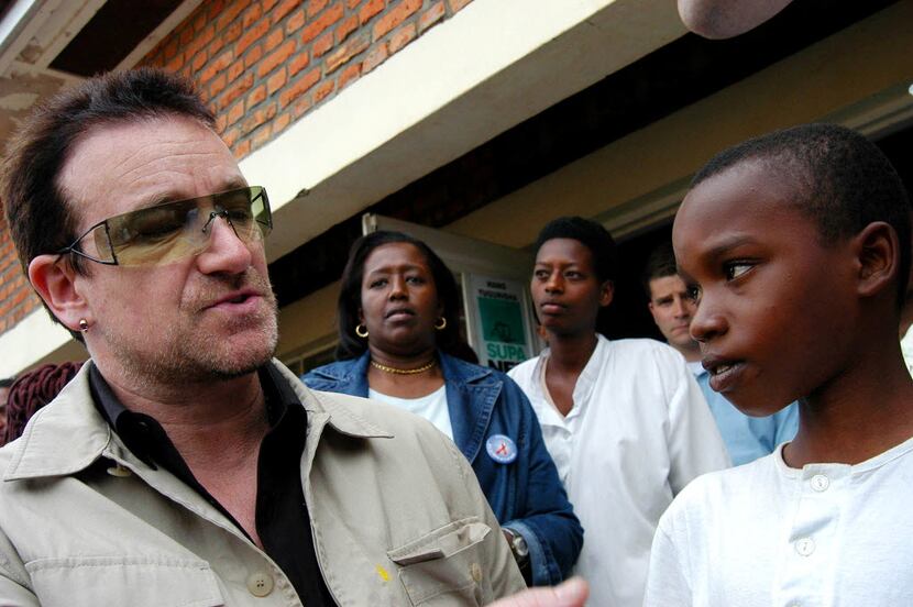 Irish rock star Bono meets an unidentified boy at a health center in Mayange, Rwanda. 