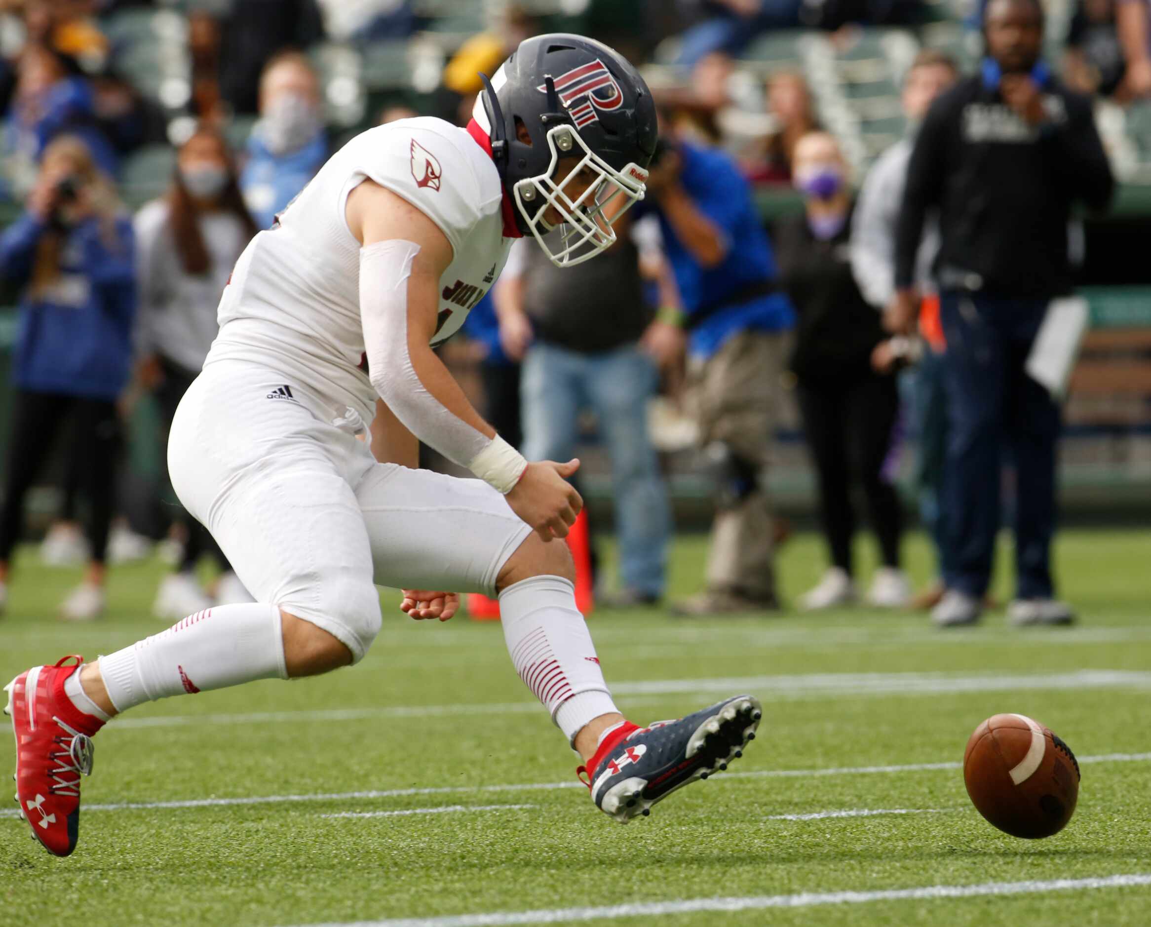 Plano John Paul punter James Knight (14) chases down an errant snap during second quarter...