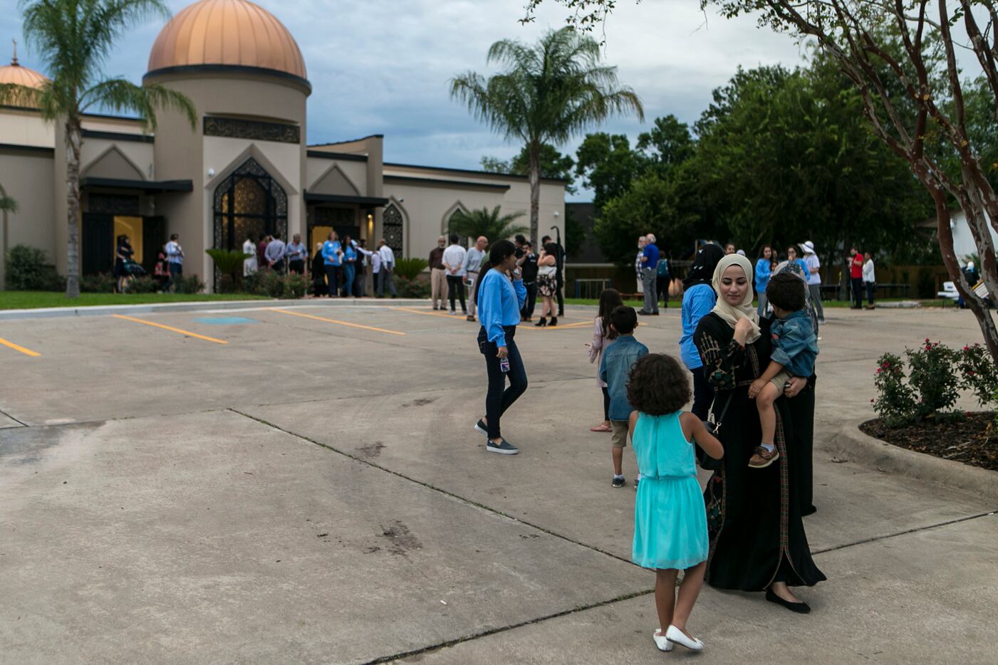 A family leaves from the newly rebuilt Victoria Islamic Center in Victoria, Texas, Saturday,...