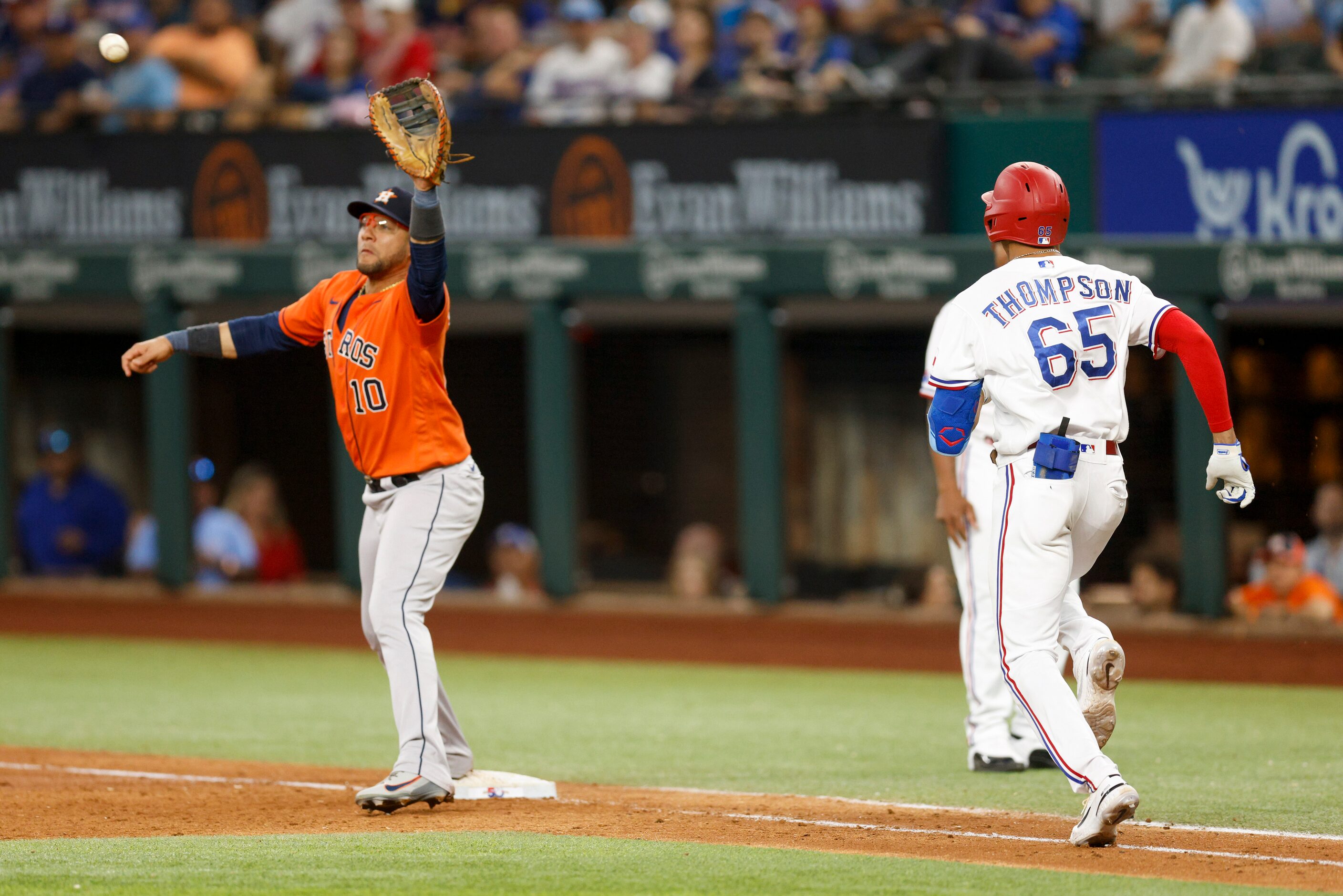 Houston Astros first baseman Yuli Gurriel (10) stretches to catch the ball and force out...