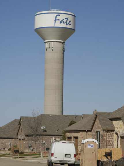 A  water tower in Fate dwarfed a new development near downtown in early 2015. The Rockwall...