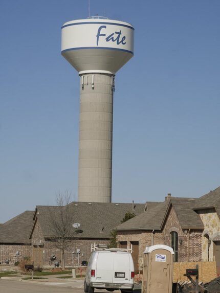 A  water tower in Fate dwarfed a new development near downtown in early 2015. The Rockwall...