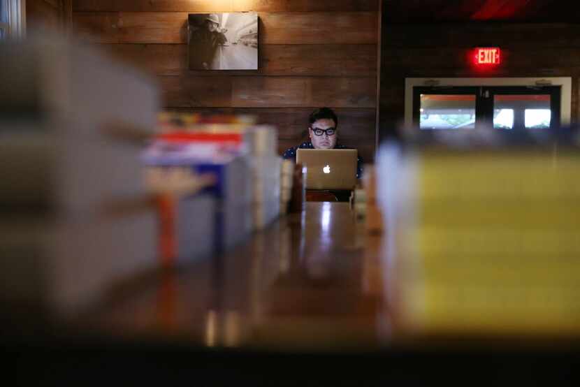 Joe Peters of Dallas works on his laptop at The Wild Detectives, which opened several months...
