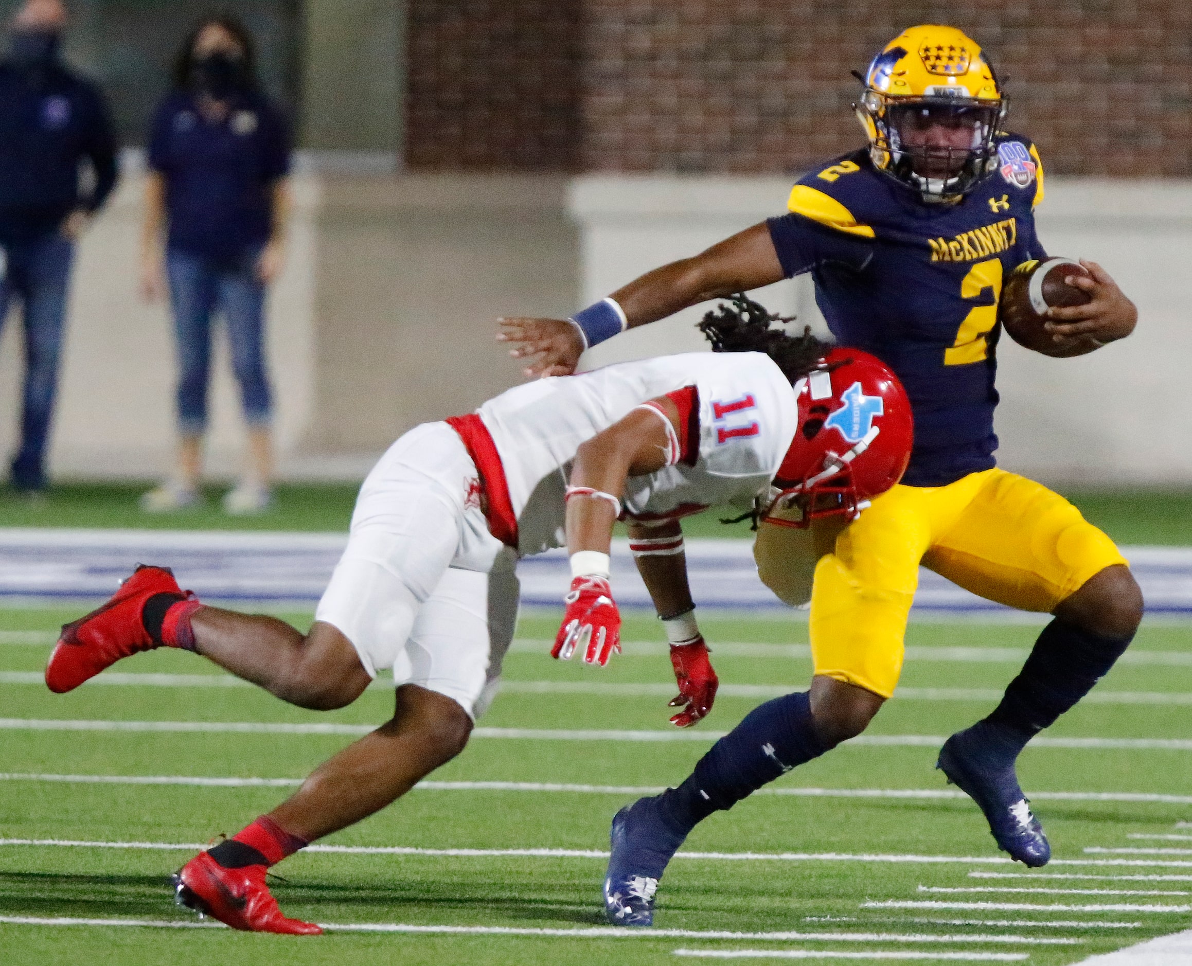 McKinney High School quarterback Ja’kobe Walton (2) is hit by Skyline High School defensive...