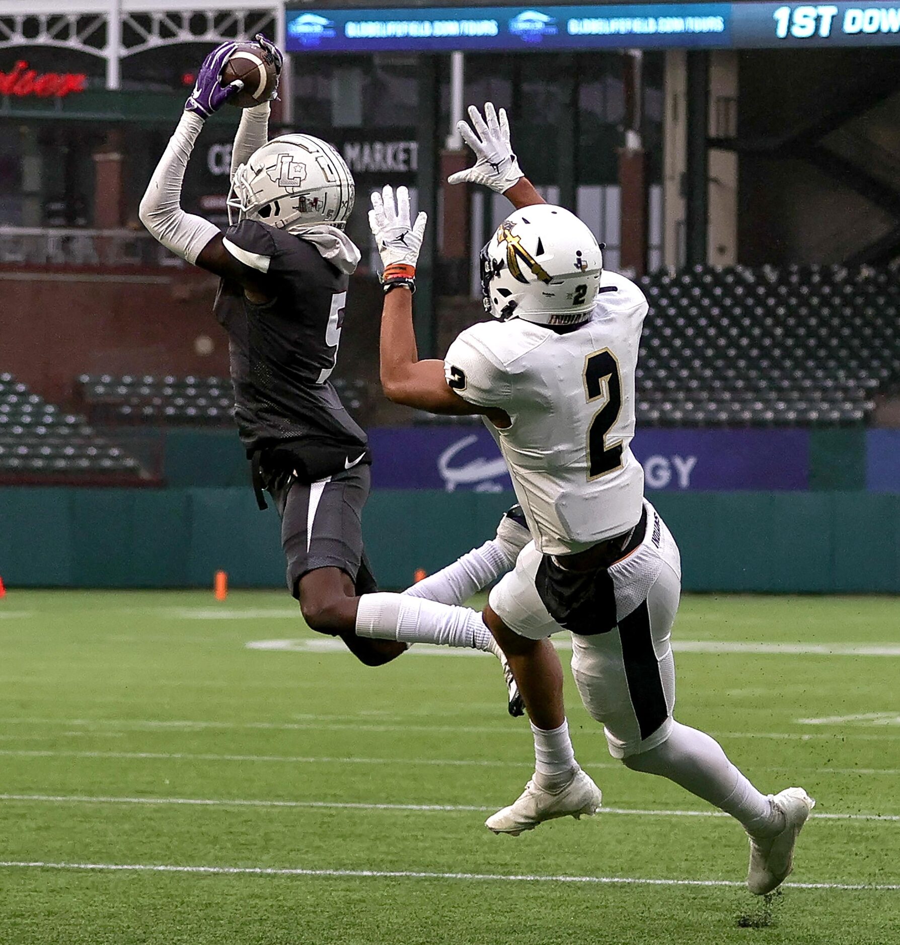 Lewisville defensive back Tony-Louis Nkuba (5) comes up with a interception in front of...