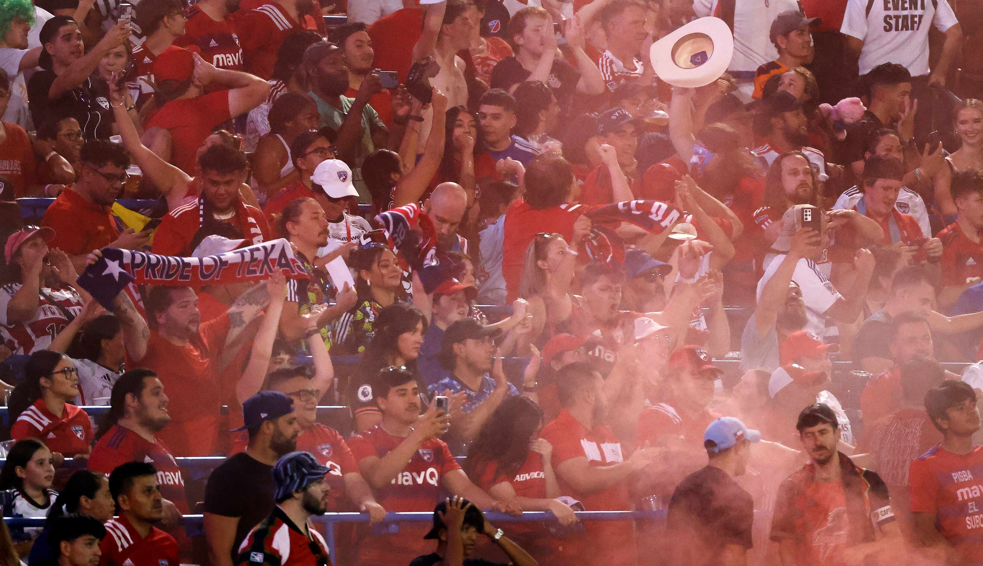 FC Dallas fans release a smoke bomb after forward Bernard Kamungo (77) scored against Inter...