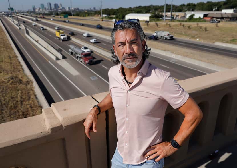 State Rep. Ramón Romero stands on the 28th Street bridge that overlooks Interstate 35W in...