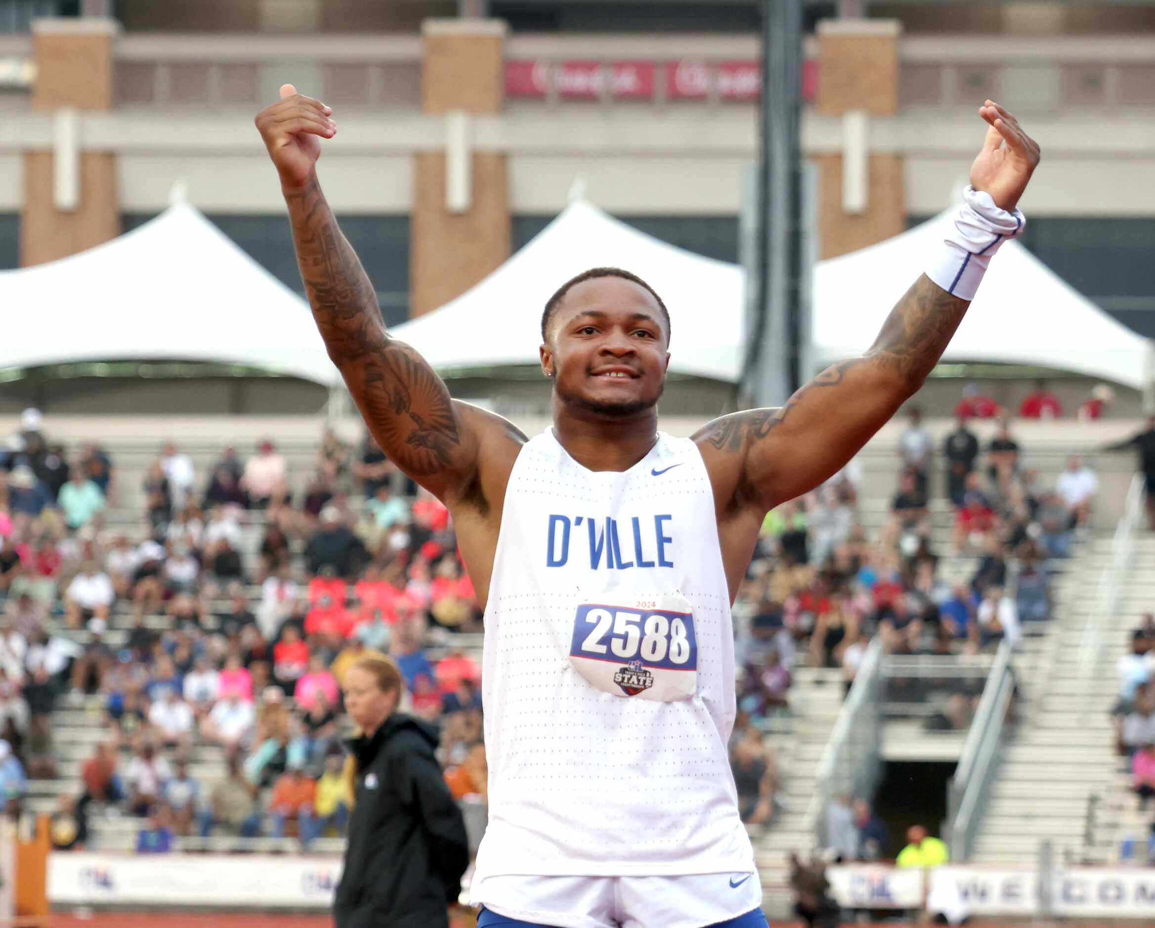 Duncanville's Caden Durham reacts to the cheers from fans after the school's Class 6A 4X200...
