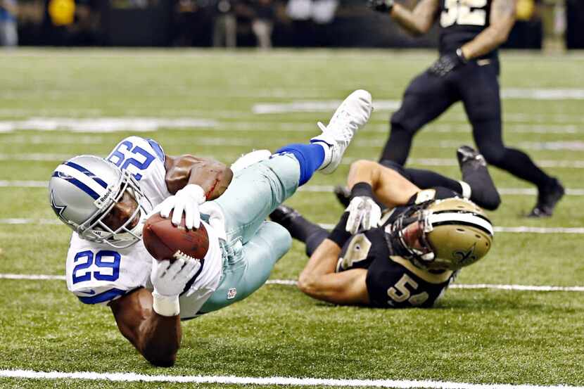Dallas Cowboys running back DeMarco Murray (29) dives past New Orleans Saints outside...