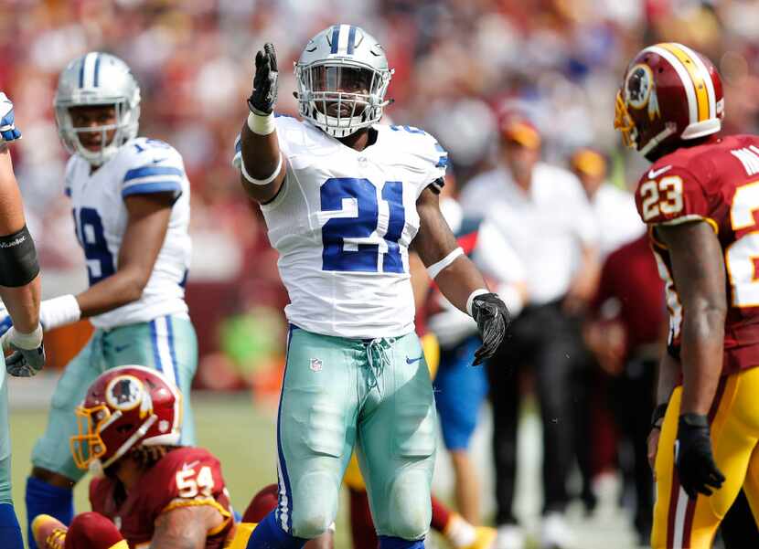 Dallas Cowboys running back Ezekiel Elliott (21) signals first down after a run play during...