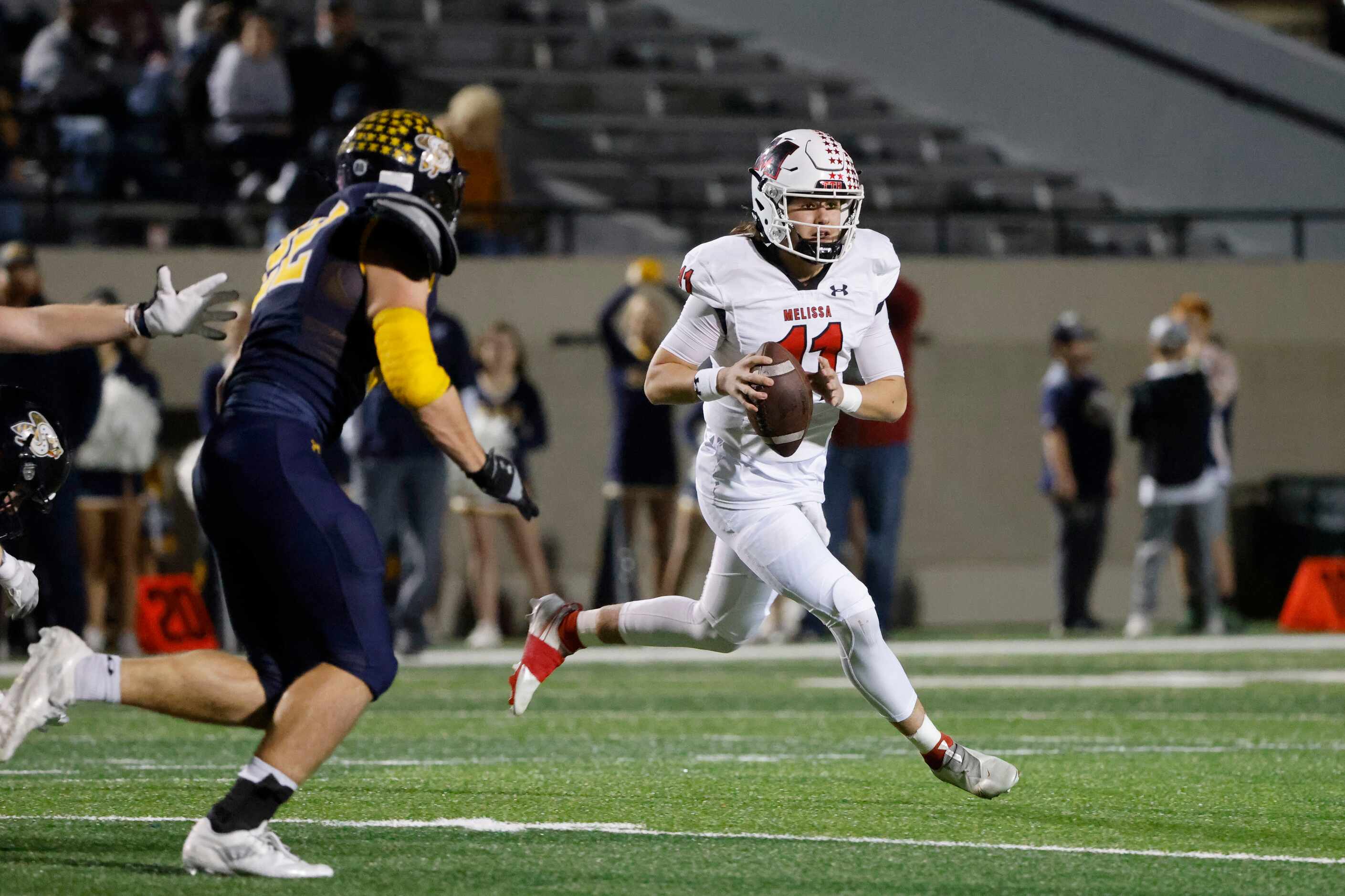 Melissa quarterback Sam Fennegan (11) rolls out as they played Stephenville during the first...