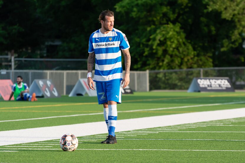 Jamie Lovegrove stands over a free kick as he awaits the signal to restart play against...