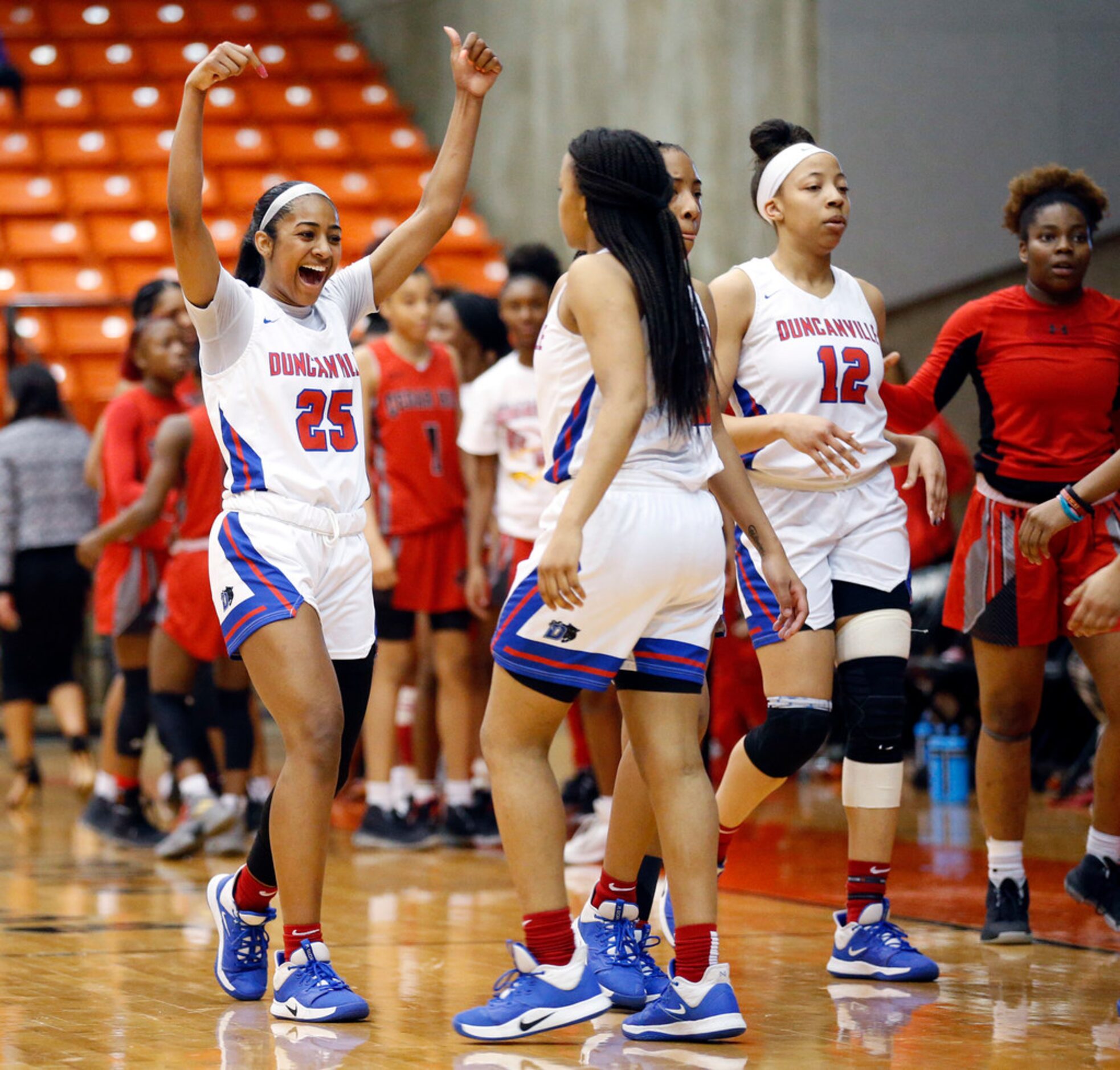 Duncanville's Deja Kelly (25) celebrates their win over Cedar Hill in the Class 6A Region I...