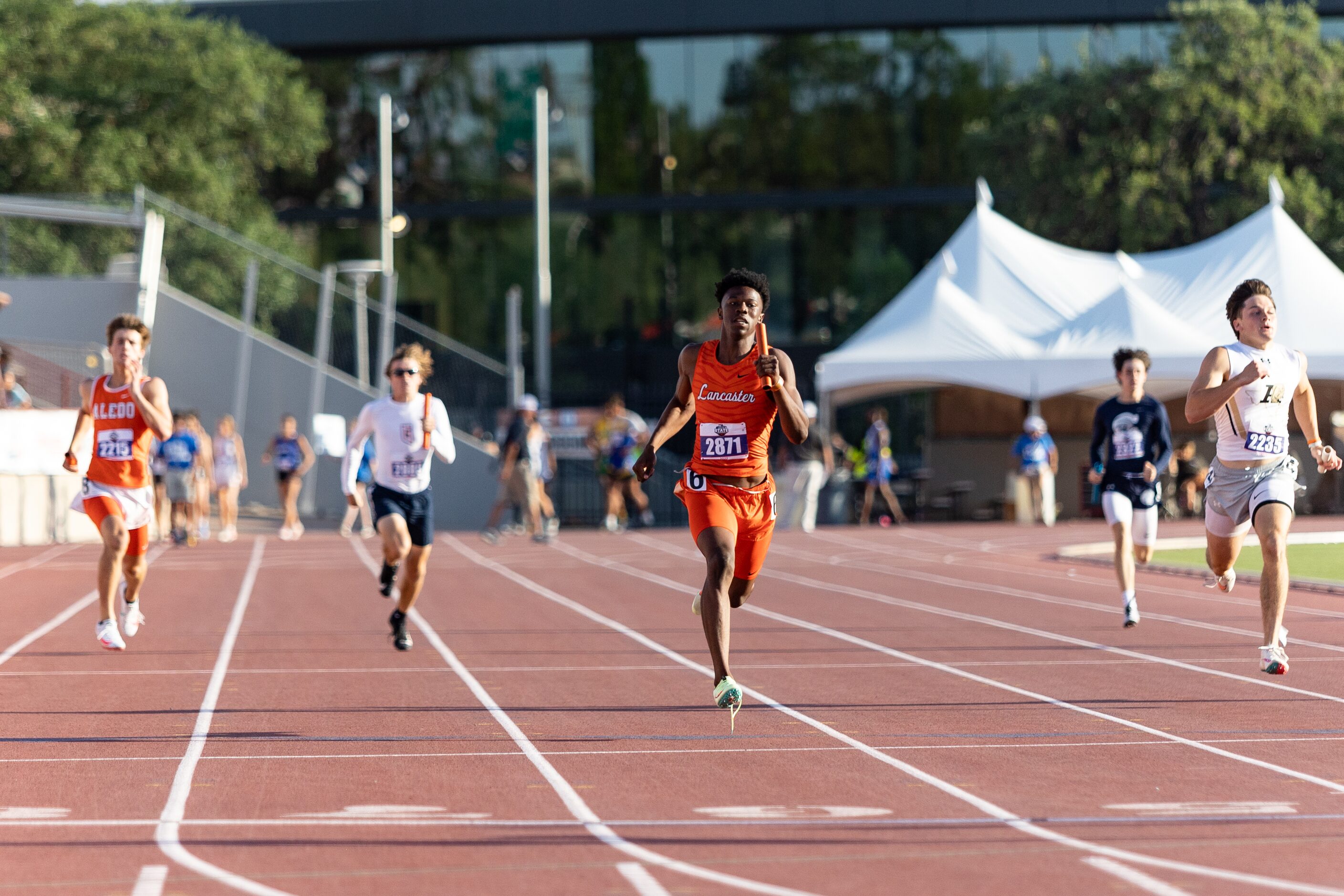 Corian Gipson of Lancaster competes in the boys’ 4x200 relay final at the UIL Track & Field...