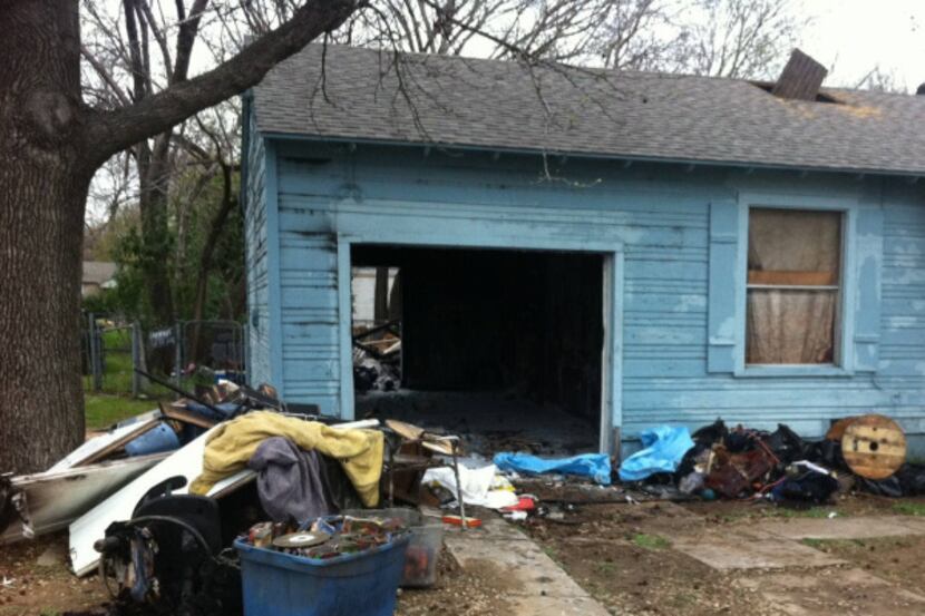 The victim lived in a converted garage in the home on Hatcher Street, near Malcolm X Boulevard.