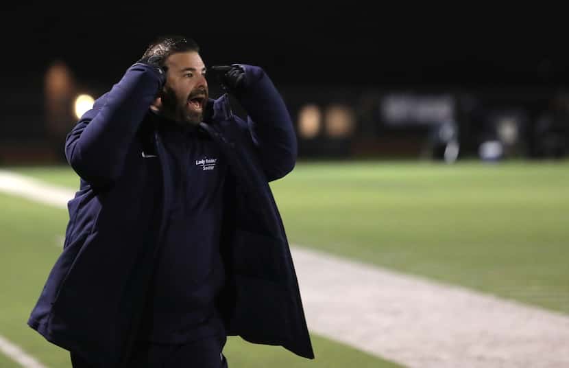 Wylie East High School coach Kody Christensen yells commands to the players during a soccer...