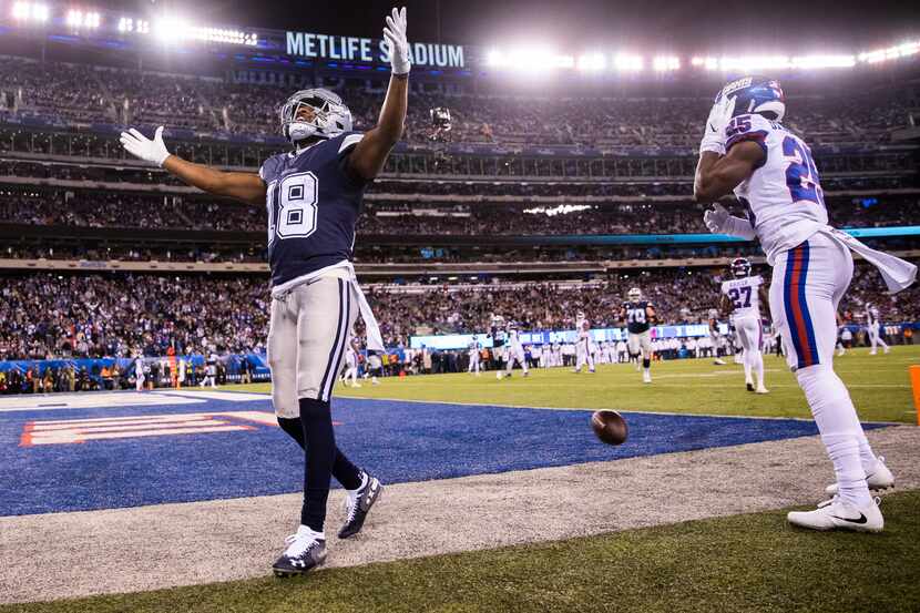 Dallas Cowboys wide receiver Randall Cobb (18) celebrates what he thought was a touchdown...